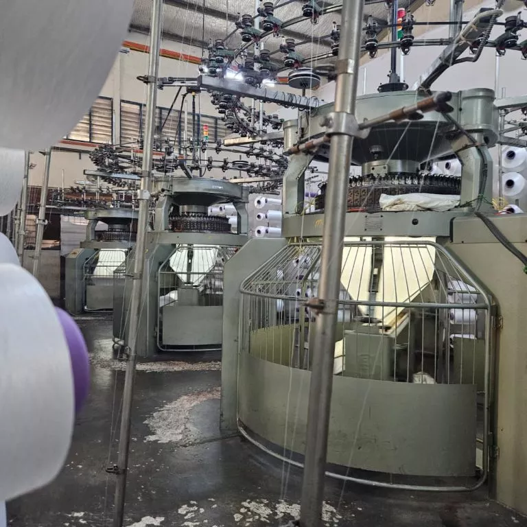Circular knitting machines at Hupsin — single jersey, piqué, interlock production